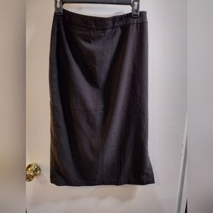 Shape FX skirt size 6 color black with a zipper back and small pocket. Side slit